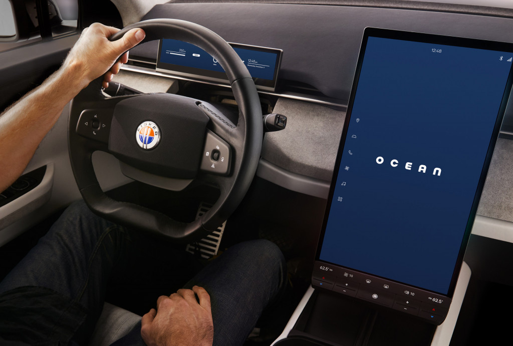 Fisker Ocean steering wheel and a large portrait center screen displaying Ocean