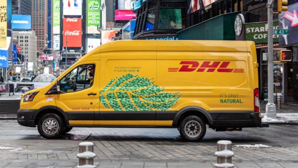 A yellow DHL electric delivery van on a New York street